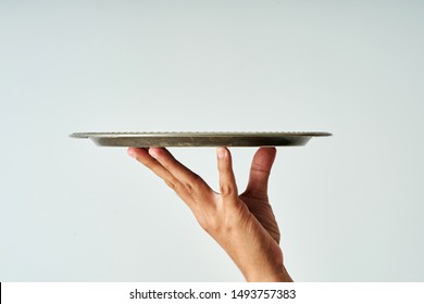 close up of hand holding a empty tray