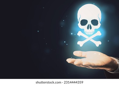 Close up of hand holding glowing white skull hologram on dark background with mock up place for your text. Cyber attack and malware concept