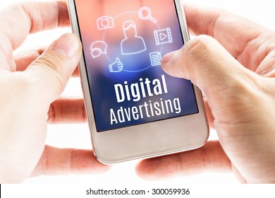 Close up hand holding mobile with Digital Advertising and icons, Digital Marketing concept. - Shutterstock ID 300059936