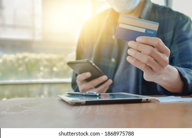 Close Up Hand Holding Mobile Phone Shopping Online With Credit, Man Stay At Home Protect Coronavirus Covid19