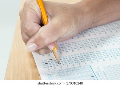 Close Up Of A Hand Holding A Pencil Taking A Standardized Test