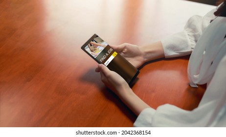 Close up hand holding smartphone. Women searching for a job online using mobile phone app. Job hunting, First jobber finding a job concept.