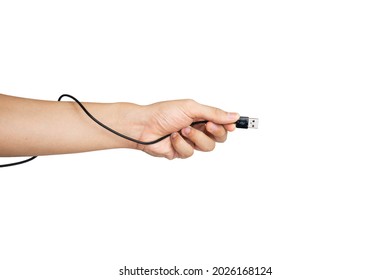 Close up of hand holding USB charging cable for phone with white background. Hand wrapped by charging cable. Asian man's hands.