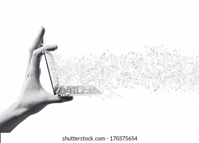 Close up of hand with laptop and media icons