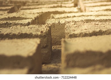 Close Up Hand made bricks form clay and dry in the sun for build houses.