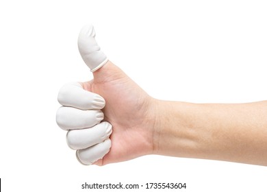 Close up of hand makes thumb up gesture in white natural rubber latex fingertip gloves isolated on white background with clipping path