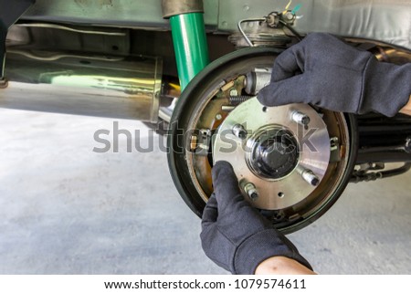 Close up hand a man change bearing of wheel in the car maintenance concept 
