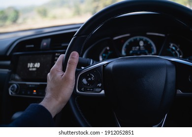 Close Up Of Hand Man Holding Steering Wheel In The Modern Car