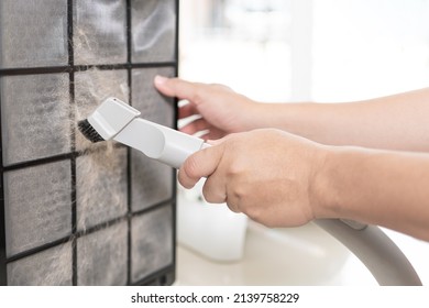 Close Up Hand A Man Is Sucking Dust And Cat Hair Out Of Air Purifier Dust Filter Cleaning For Good Health  In The Home 