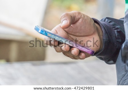Close up hand of a man using mobile smart phone, copy space for text. technology concept. communication concept.