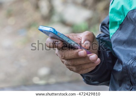 Close up hand of a man using mobile smart phone, copy space for text. technology concept. communication concept.