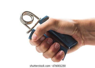 Close Up Of The Hand Of A Man Using A Resistance Tool To Exercise The Forearm And Strengthening The Grip