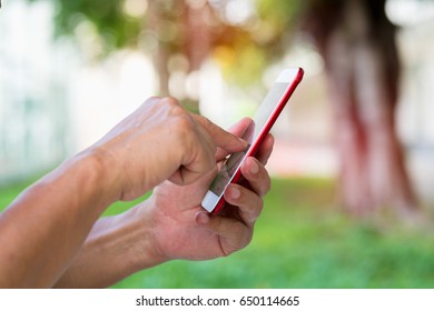 Close up hand man using smartphone