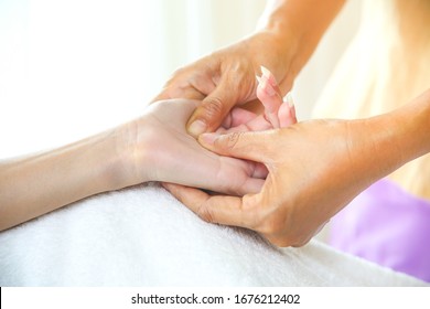 Close Up Hand Of Masseuse With Pressure Point Massage On Female Hand For Blood Circulation And Fatigue, Hand Massage Concept, Copy Space