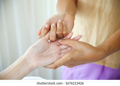 Close Up Hand Of Masseuse Use Two Finger To Pull Female Finger Lightly For Blood Circulation And Fatigue, Hand Massage Concept, Copy Space