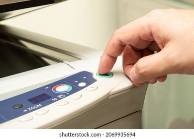 Close Up Hand Of Office Man Press The Copy Button On Panel To Using The Copier Or Photocopier Machine In Copy Room For Scanning Document Printing