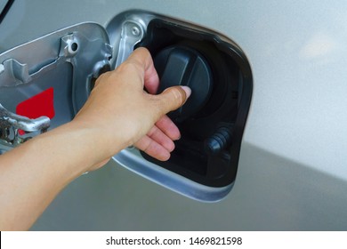 Close Up Hand Open And Close Gas Tank Cap White Car To Fill It With Fuel - Part Of Hand