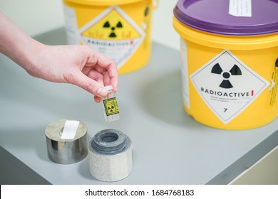 Close Up Hand Open Lead Box Of Iodine 131(I-131)Radioactive Isotopes Used For Hyperthyroidism Treatment.