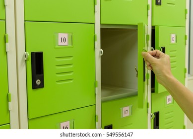 Close Up Hand Opening The Locker Door.  