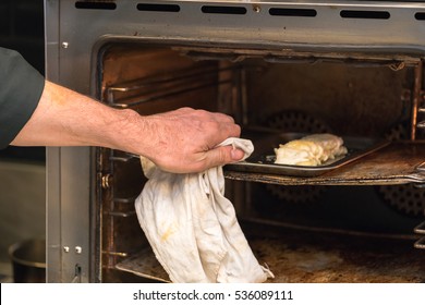 close up of hand with oven