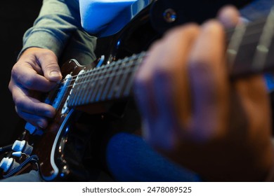 Close up hand playing electric guitar. Musician playing guitar, live music. Man playing guitar. Musical instrument. Electric guitar. Repetition of rock music band. - Powered by Shutterstock