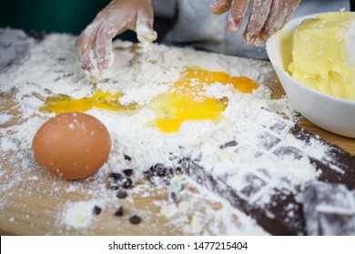 Close Up Hand Playing With Flour Eggs, Kids Cute Girl Having Fun Making Cake, Messy Kitchen. 