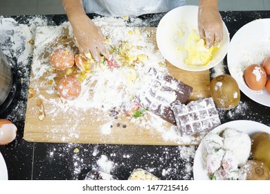 Close Up Hand Playing With Flour Eggs, Kids Cute Girl Having Fun Making Cake, Messy Kitchen. 