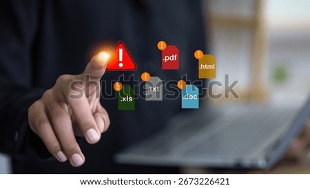 Close up hand pointing at warning alert with document file icons including PDF, DOC, XLS, TXT, and HTML, cybersecurity risk, data protection, and online security concept.