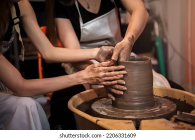 Close up hand potter preparing ceramic clay to making pottery vase, workshop in hand craft studio, Art and hobby handmade concept.