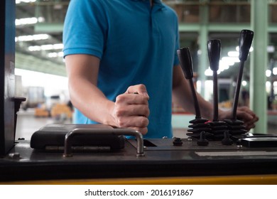 Close Up Hand Of Professional Forklift Driver In Factory's Warehouse. Industrial And Industrial Workers Concept.