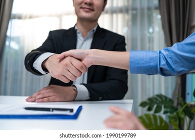 Close Up Hand Of Salesman Banker Handshake With Investor Girl For Loan Insurance Investment After Negotiation For Business Deal And Acquisition. Businesswoman Sign Contract Agreement On Paper With Pen