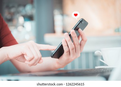 
Close Up Hand Take Smart Phone Look  Message From Lovers. Send A Message Encouraging.