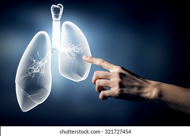 Close up of hand touching lungs sign