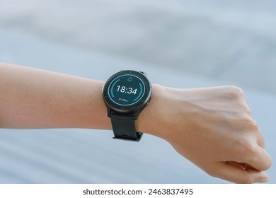 Close up of hand touching smartwatch with heart rate checking app on the screen. - Powered by Shutterstock