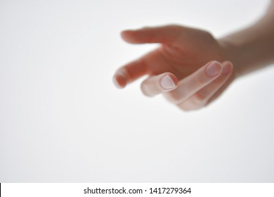 Close Up Of Hand Trying To Reach For Someone Or Something. Gesture Of Giving Or Asking Help Or Sign For Lust Isolate On White Background. Carrying For You.  