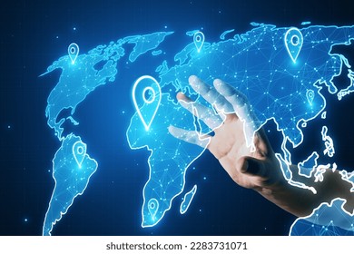 Close up of hand using glowing map with location pins on blurry blue background. GPS and navigation concept