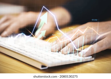 Close up of hand using keyboard with creative glowing forex graph on blurry background. Market analysis and trade concept. Double exposure