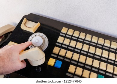 Close Up Hand Using Of The Retro Rotary Telephone. Wired Communications Equipment.  Old Telephone With Switchboard Operator