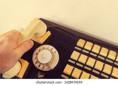 Close Up Hand Using Of The Retro Rotary Telephone. Wired Communications Equipment.  Old Telephone With Switchboard Operator. 