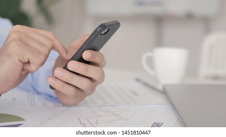 Close Up of Hand Using Smartphone