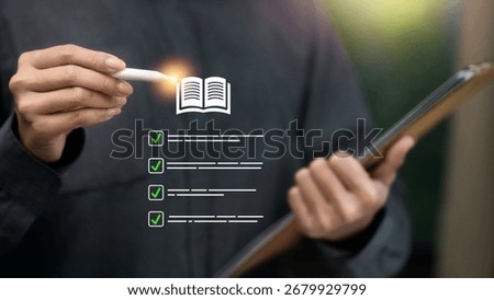 Close up hand using stylus with digital checklist and open book icon on tablet; concept of e-learning, course planning, task completion, assessment review, training compliance and quality assurance.
