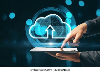 Close up of hand using tablet with creative glowing clouds hologram on blurry binary code background. Cloud computing and database concept. Double exposure - Powered by Shutterstock - Get 15% off with code: PIKWIZARD15