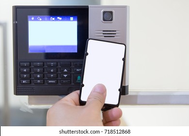 Close Up  Hand Using White Keycard To Open Door Access Control By Digital Access Control Lock And Have Digital Clock On Screen. Optional Function With Time Attendance Record. 