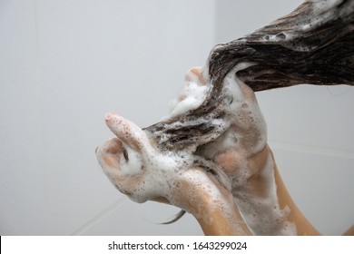 Close Up Hand Washing Hair With Shampoo Foam