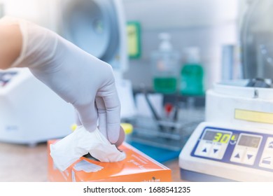 Close Up Of Hand Wearing Glove Holding A Glove Box