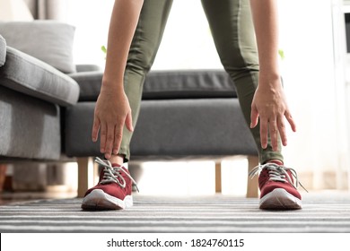 Close Up Hand Woman Touching Her Toes Stretches. Standing Forward Bend Yoga Pose Stretch At Home.