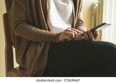 close up of hand woman typing on smart phone at home - Shutterstock ID 175639667