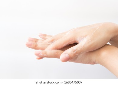 Close Up Hand Of Woman Washing Hands With Soap On White Background