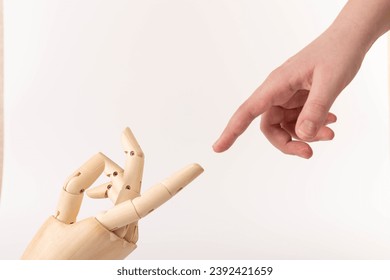 Close up of the hand of wooden mannequin hand shaking human hand. Hands concept. Hope. Help. Concept.  - Powered by Shutterstock