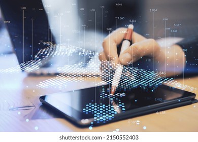 Close up of hand at workplace using tablet with pen and abstract digital map and index lines on blurry background. Global infographic, world and location concept. Double exposure